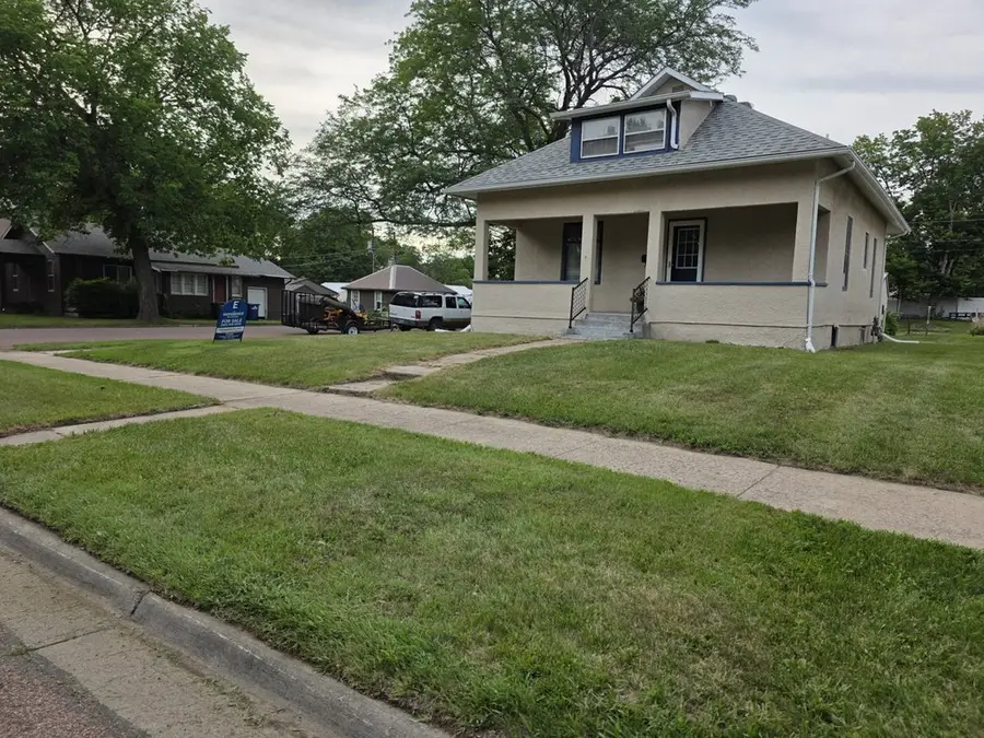 A freshly mown front lawn either side of the sidewalk at a Mount Vernon home
